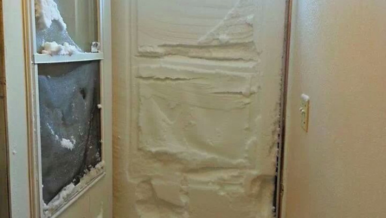 Входную дверь засыпало немного снегом