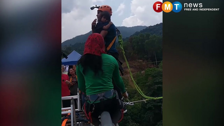 Мужчина с 2-летней дочерью прыгнул с тарзанки .